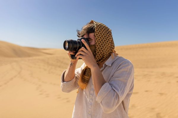 side-view-man-taking-photos-with-camera (1)
